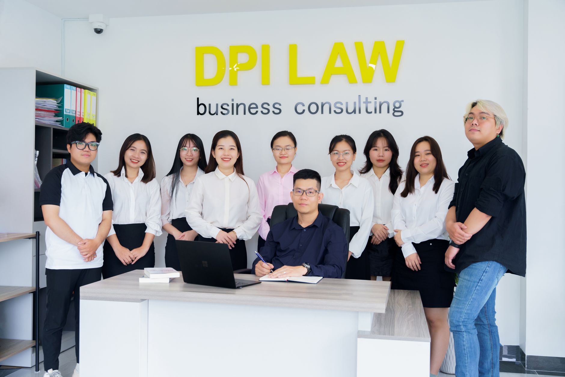 Qualifi Level 3 Extended Diploma in Business and Law — A diverse group of professionals in a business consulting office setting.