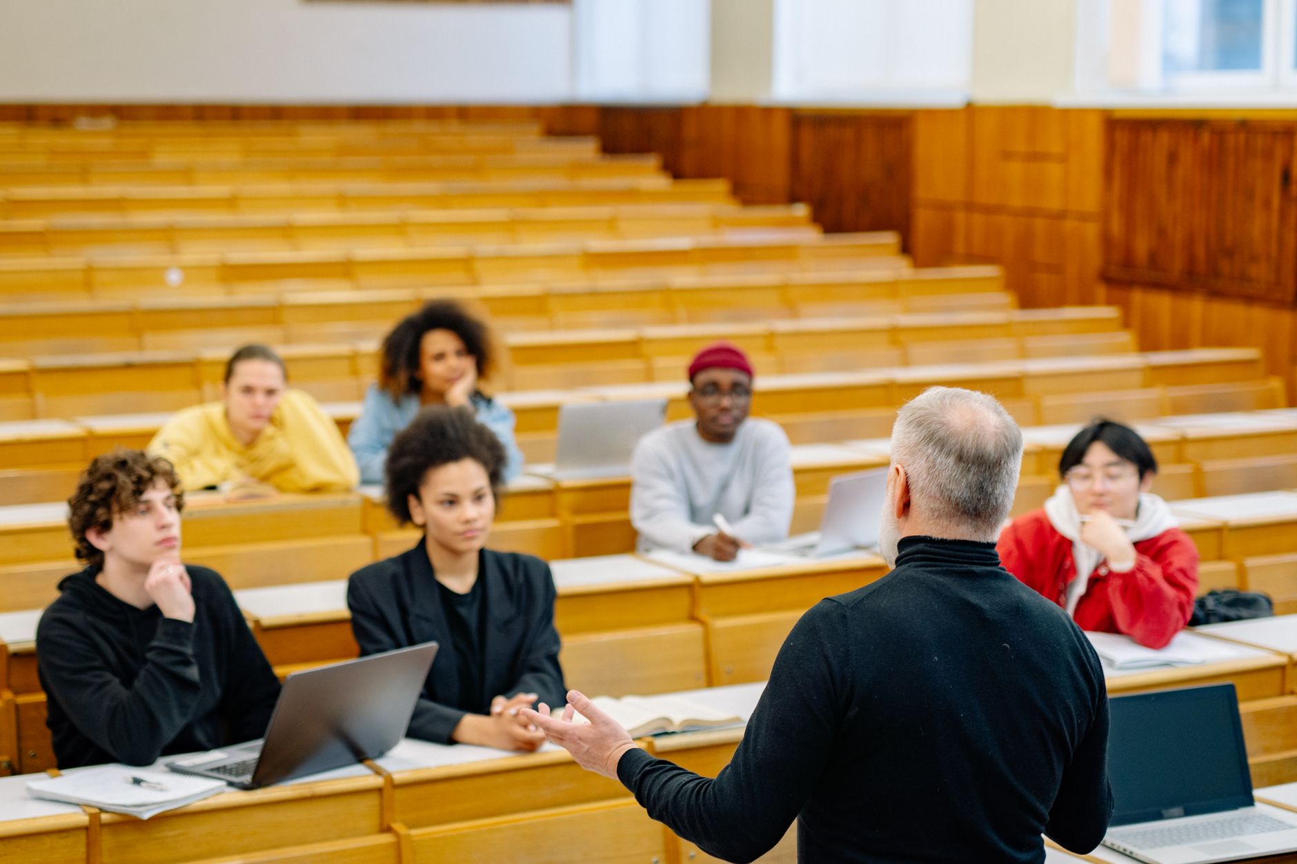 Qualifi Level 5 Diploma in Law — Students attending a lecture in a university classroom with an engaged professor.