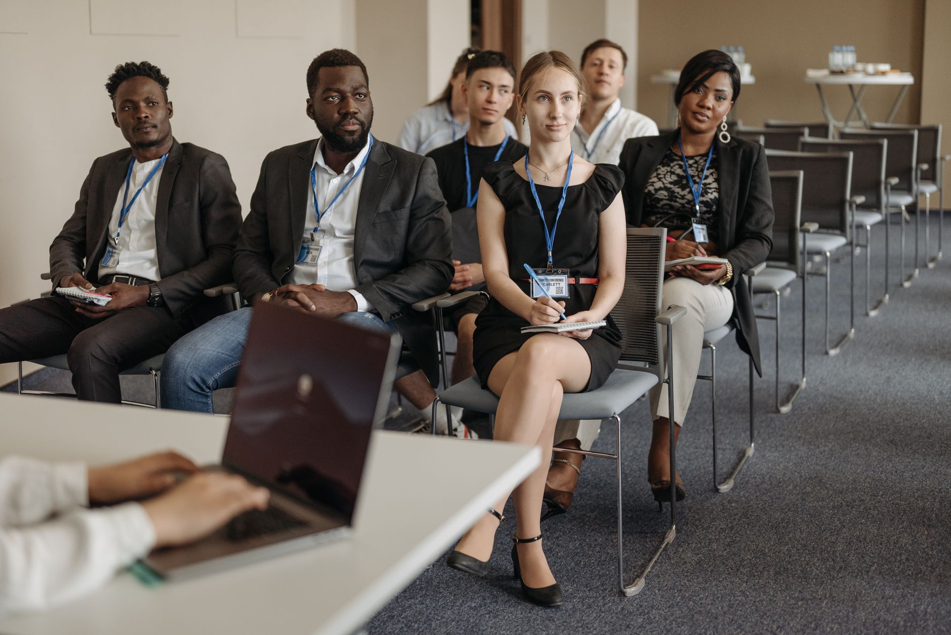 An Introduction to the Business Environment — Diverse group of business professionals attentively attending a conference session.