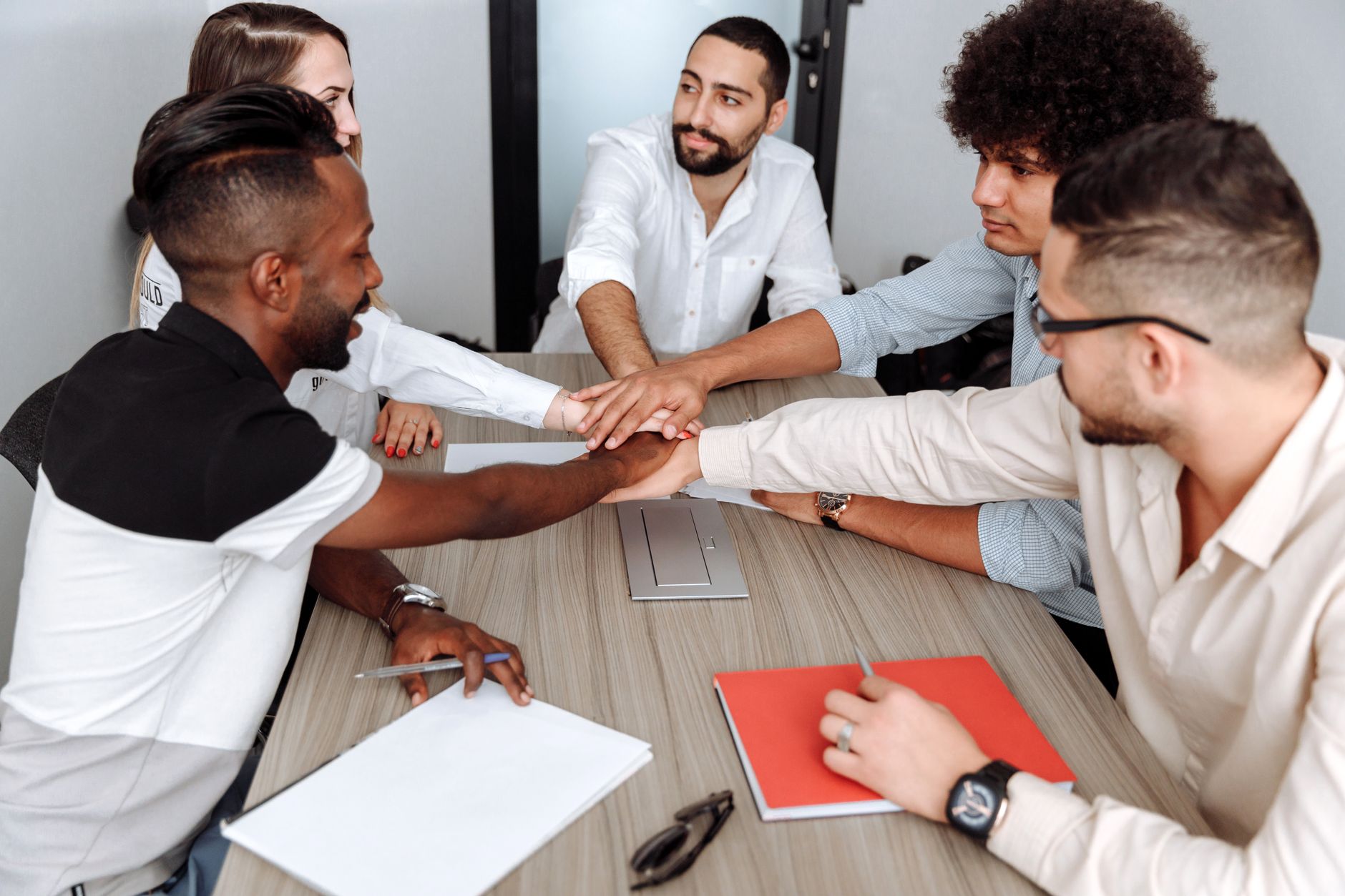 Thinking Entrepreneurially — A diverse team of coworkers engaged in a collaborative meeting at the office.