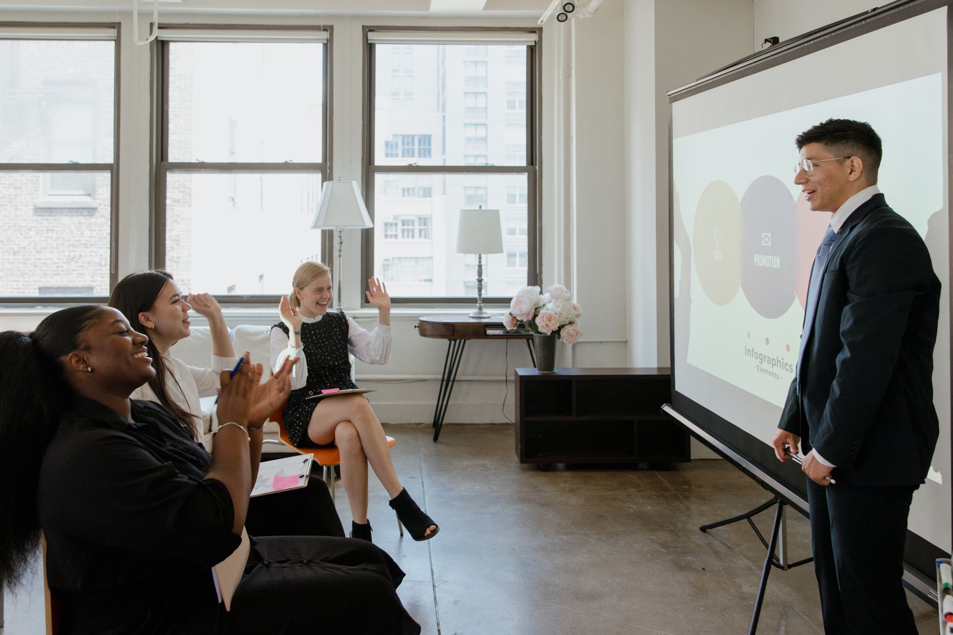Innovation for Business — Enthusiastic office team attending a professional presentation, engaging and learning.
