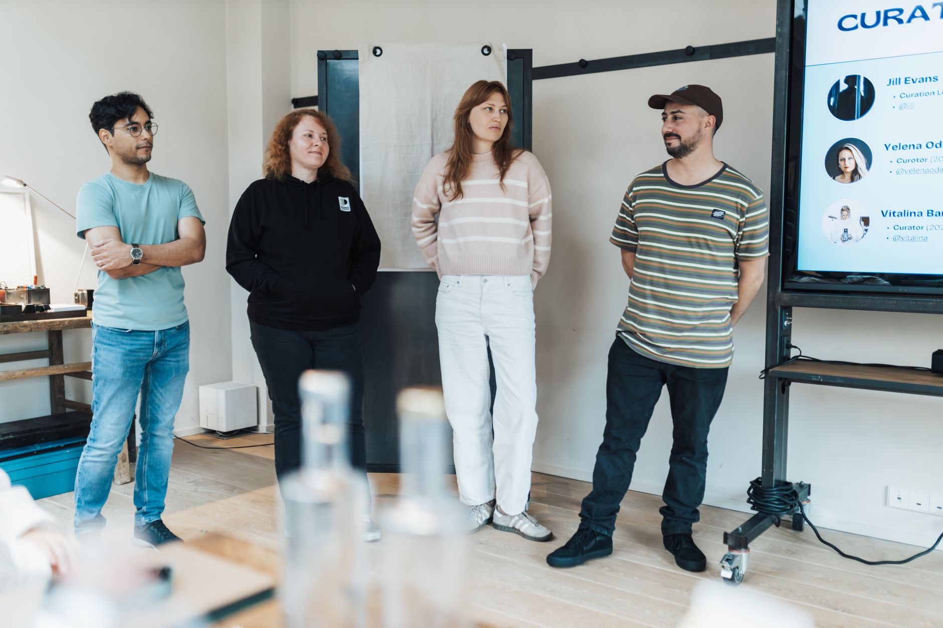 Workplace Welfare — A team of diverse individuals presenting at a business meeting in a modern office setting.