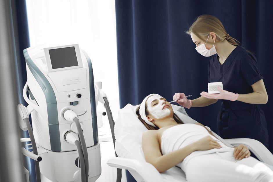 Qualifi Level 6 Award in Advanced Aesthetic Procedures: Micro-needling — Woman receiving a rejuvenating facial treatment at a spa from a skilled therapist.