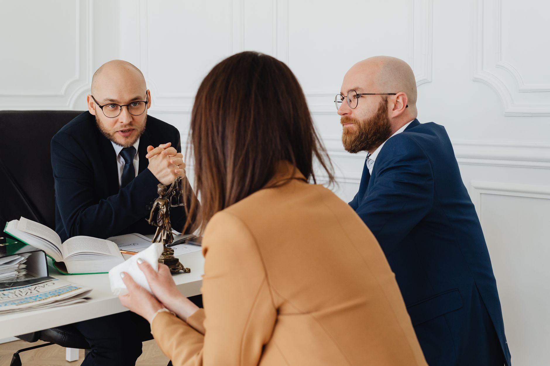 Business Law — Professional discussion among lawyers in a modern office, focusing on legal matters.