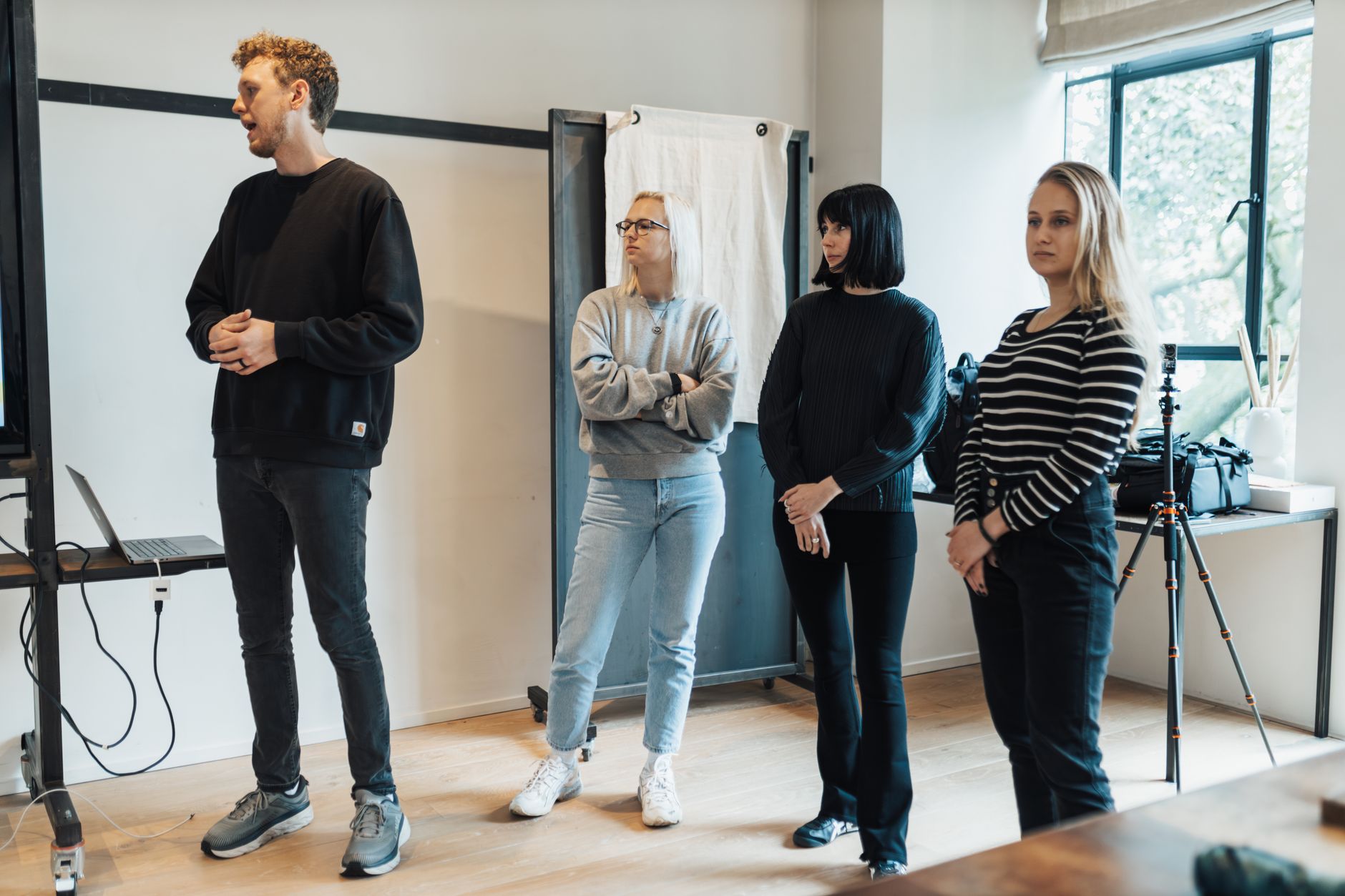 Contemporary HRMMarketing Specialism — A diverse team in a modern office setting during a professional presentation.