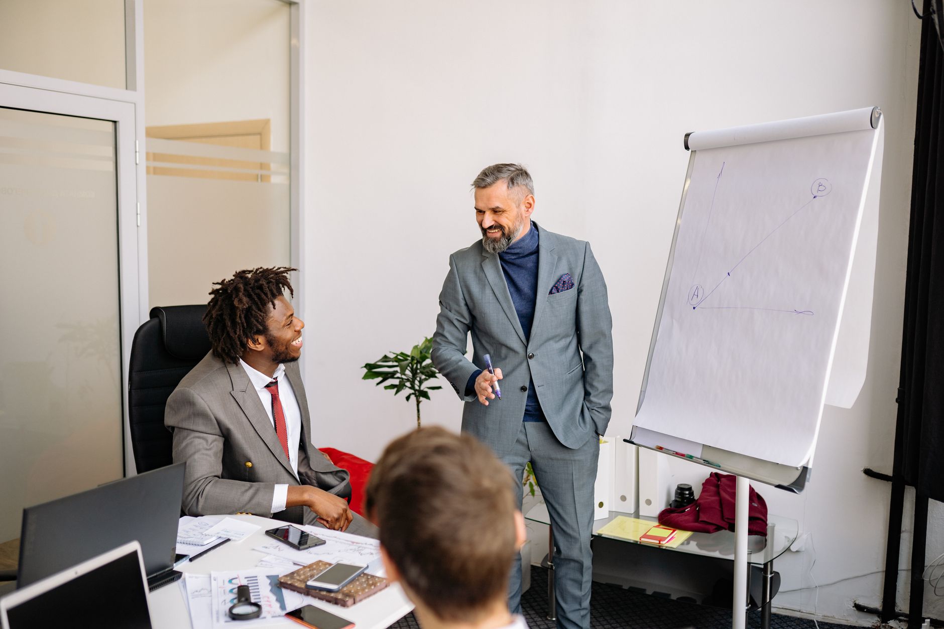 Risk Analysis and Modelling — Professional meeting with businessmen collaborating on a project