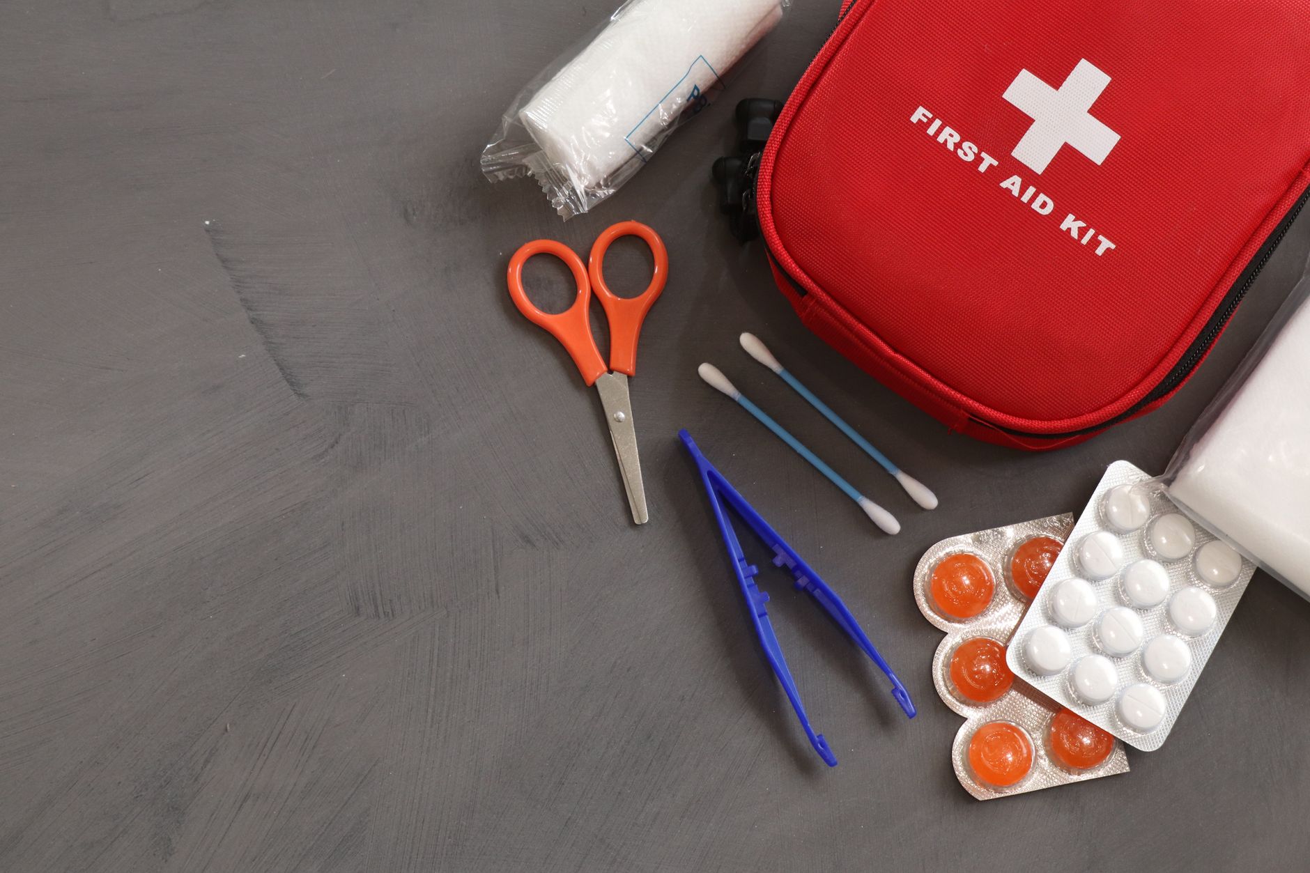 Basic Life Support and Management of Anaphylaxis — A comprehensive first aid kit with essential medical tools and supplies for emergencies.