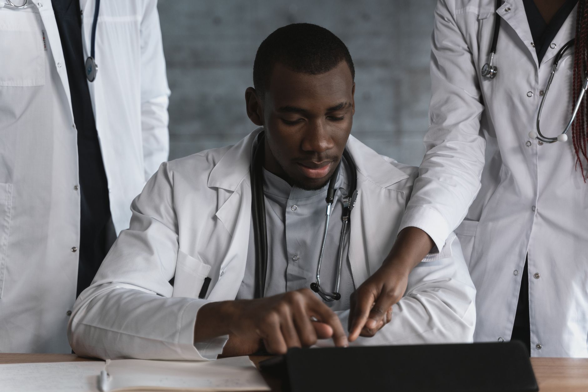Research Project — Doctors in discussion over a medical research project in a clinical setting.