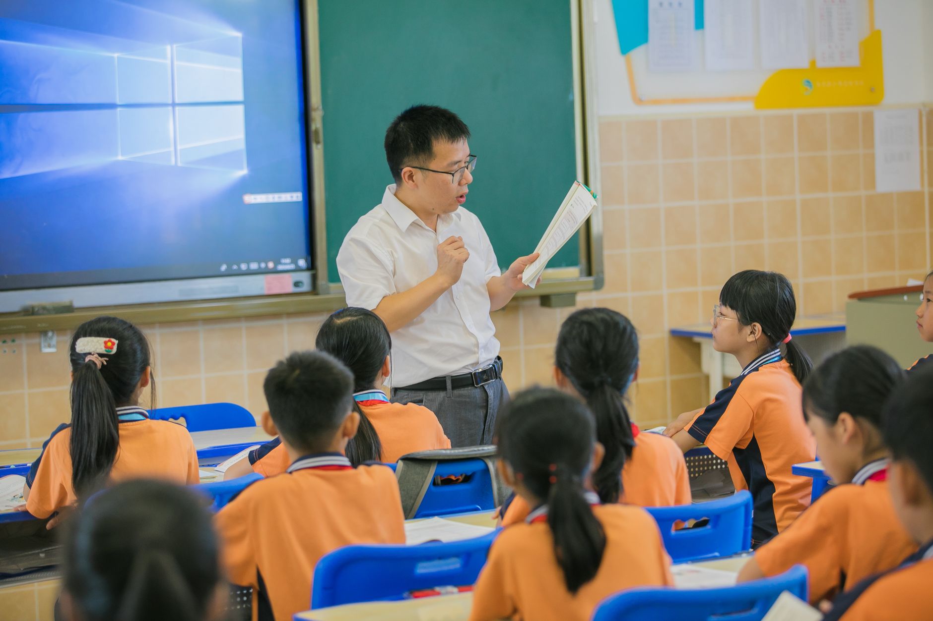 The Scope of Psychology — Teacher instructing attentive students in a classroom setting, fostering education and learning.