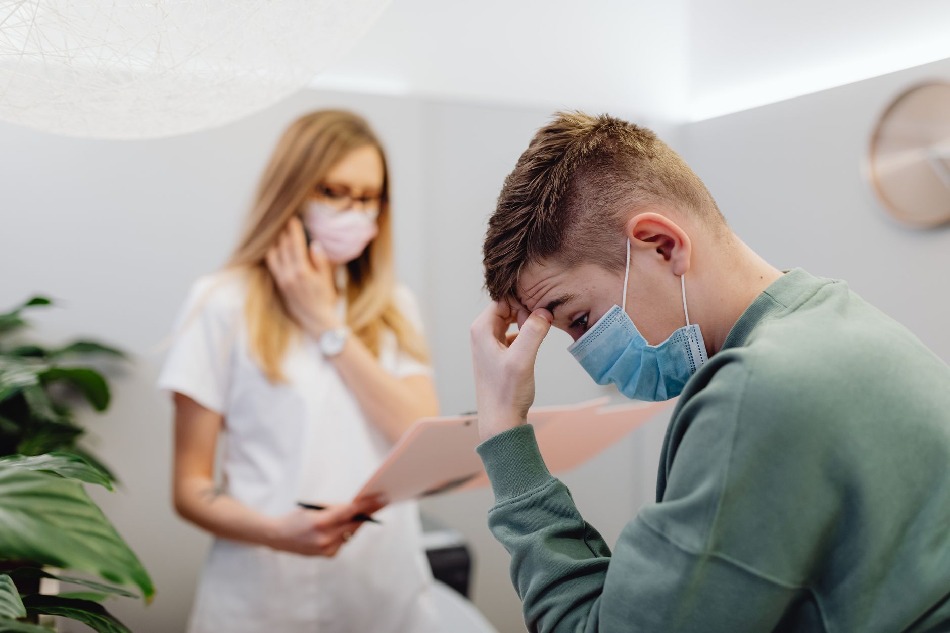 Psychoanalysis and Mental Health — A worried patient discusses with a healthcare professional in a medical office setting.