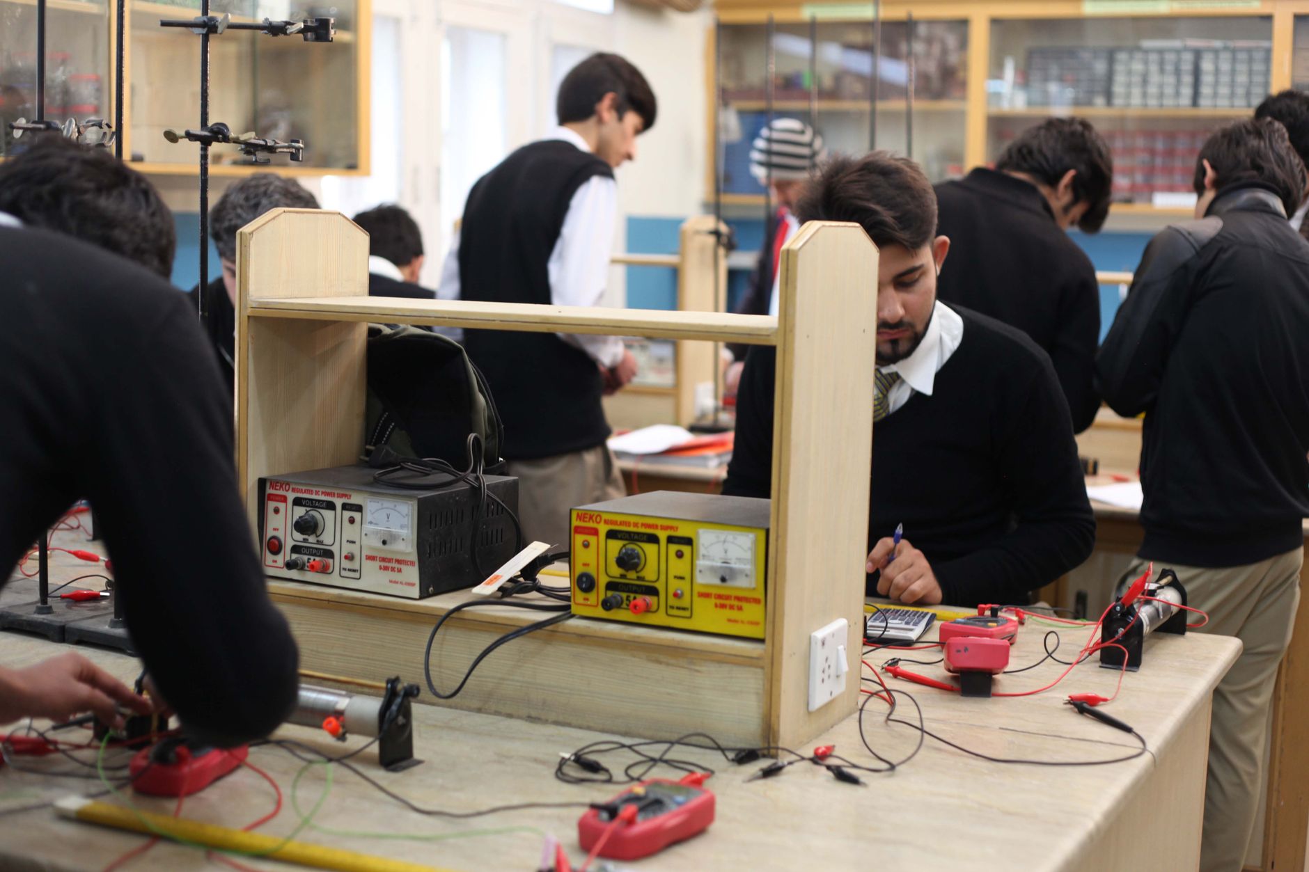 Research Project — Students working on electronics projects in a lab, focusing on practical learning.