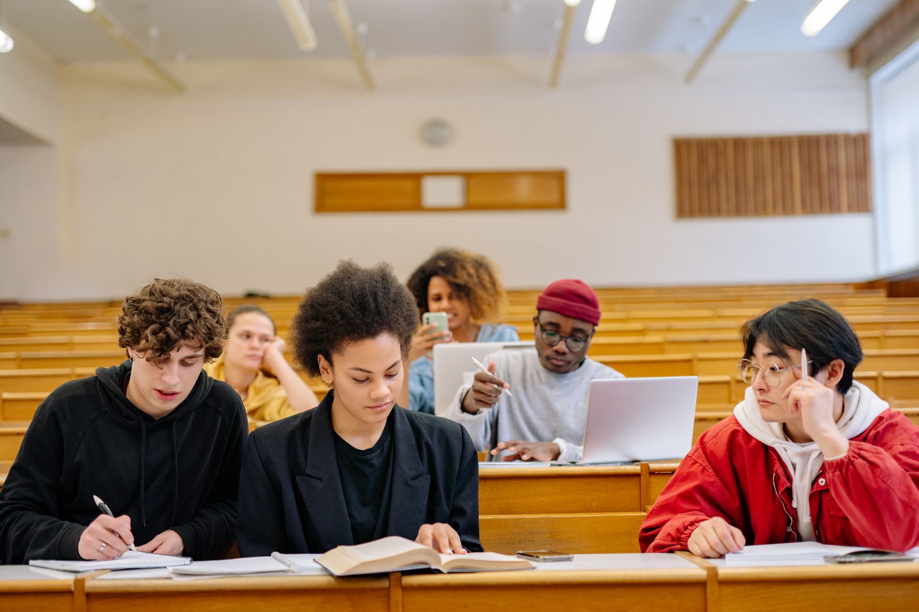 Organisational Culture — Students of diverse backgrounds engaging in collaborative learning in a university classroom.