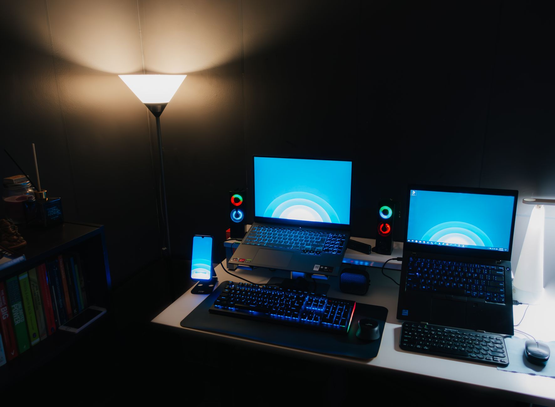 Network Device Installation and Debugging (Smart Home) — Nighttime office desk setup with laptops, illuminated keyboard, and ambient lighting.