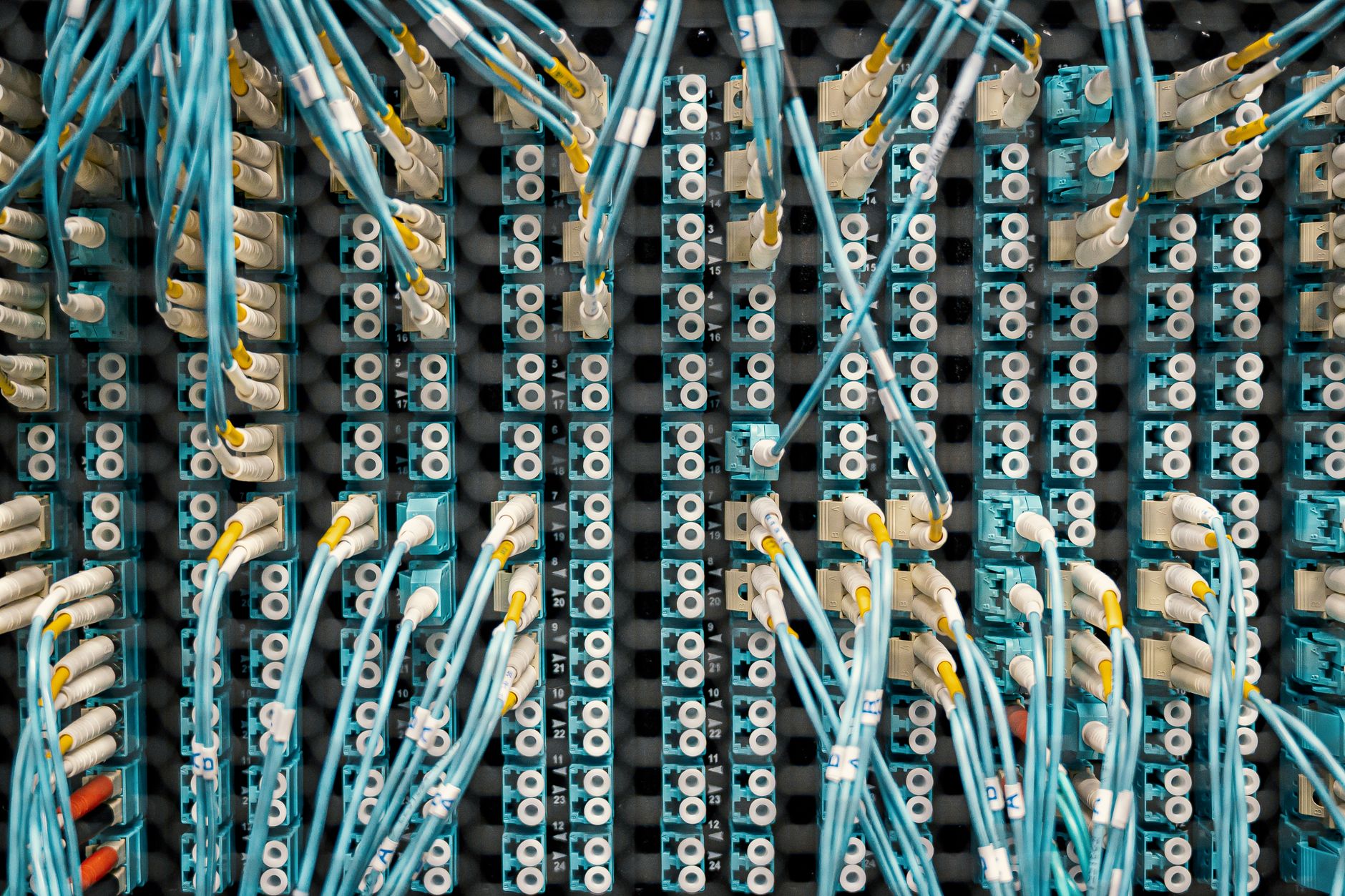 Integrated Wiring of Information Networks (Smart Home) — Top view of fiber optic cables connected to ports in modern data server