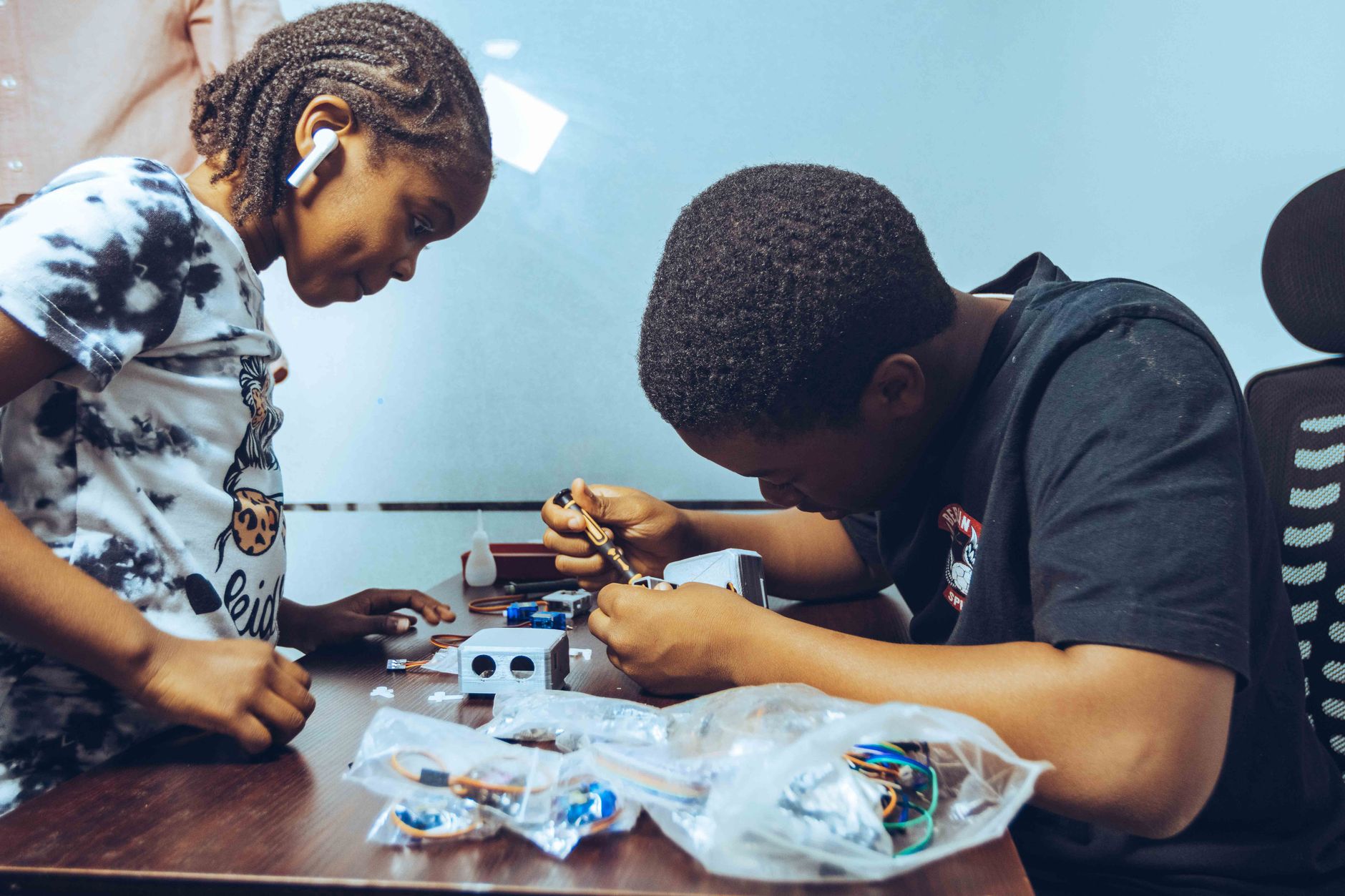 Engineering (Smart Home) — Two students engaged in hands-on electronics learning in a classroom setting in accra, ghana.