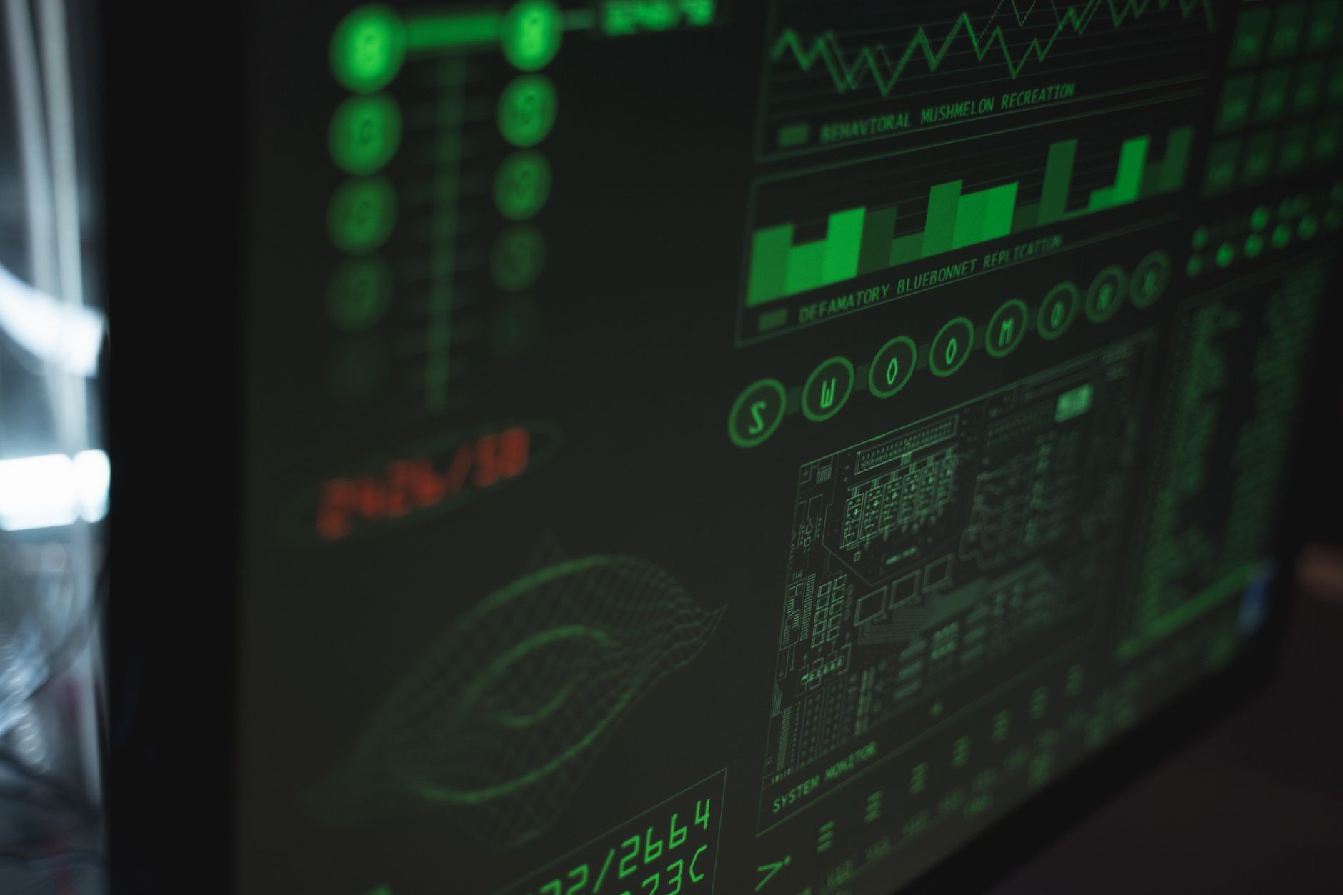 Network Architecture: Communications and Protocols — Close-up view of a computer displaying cybersecurity and data protection interfaces in green tones.