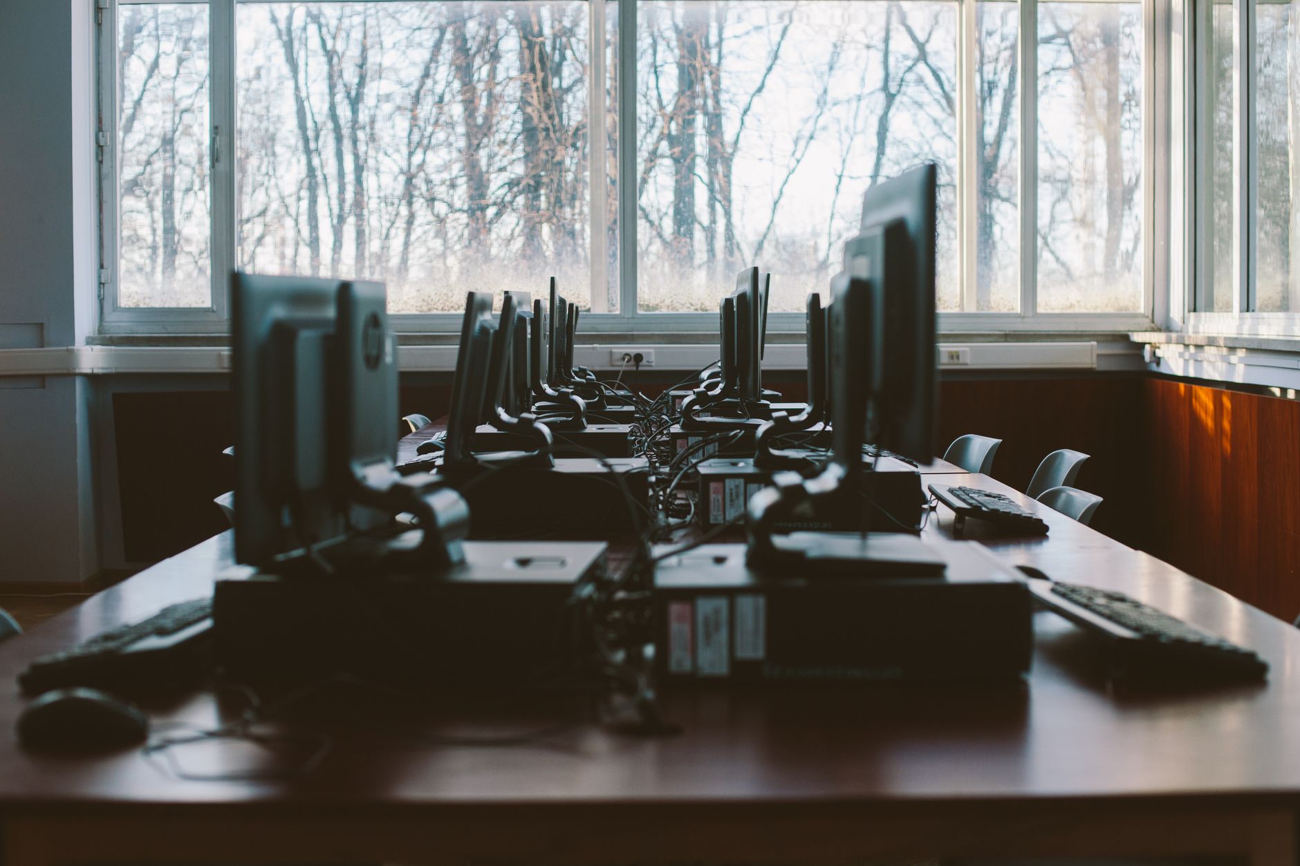 and then choose their subject area to complete another 120 credits. Units — An empty computer lab with multiple workstations and large windows during the daytime.