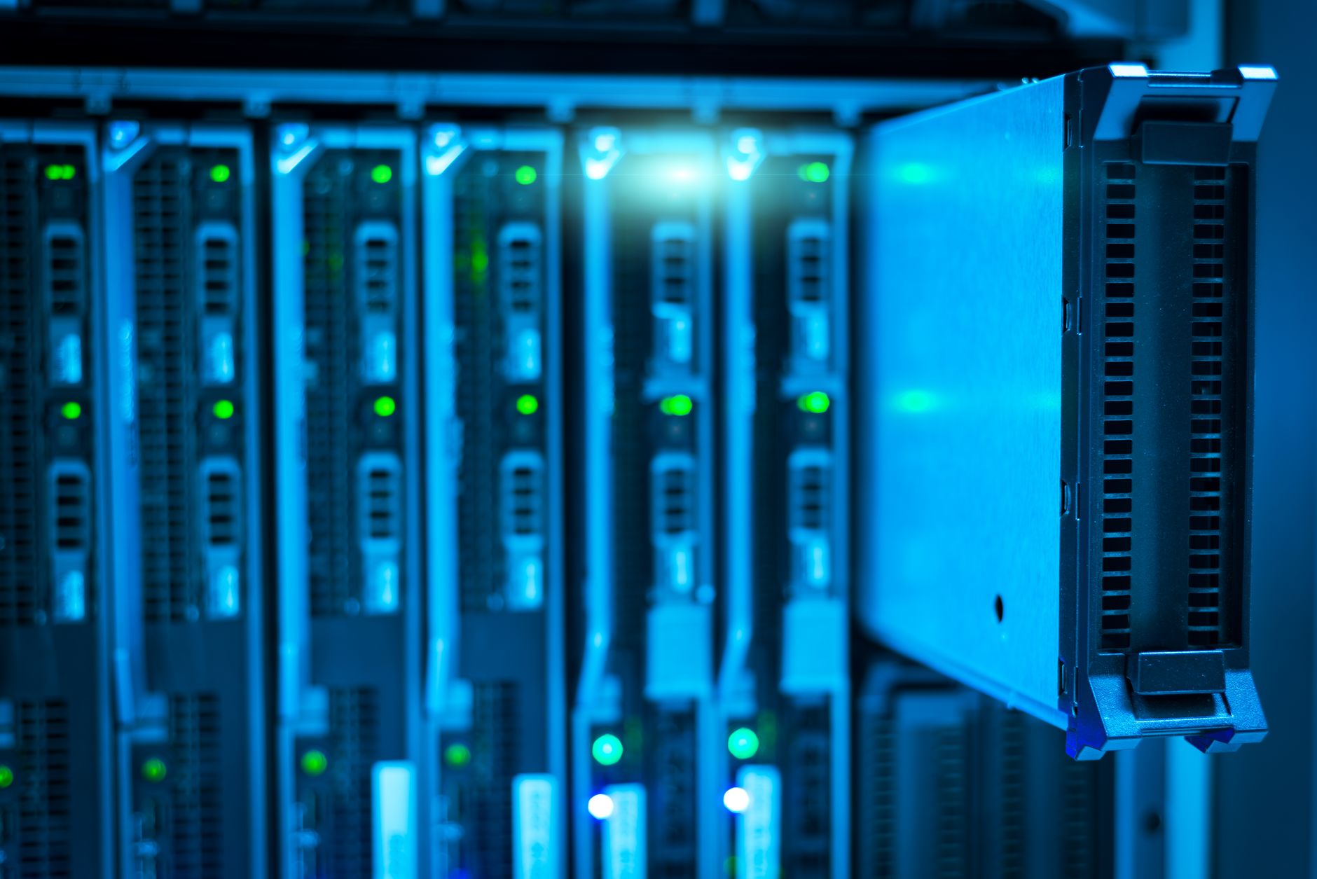 Network, Infrastructure and Systems Security — Detailed view of a server rack with a focus on technology and data storage.