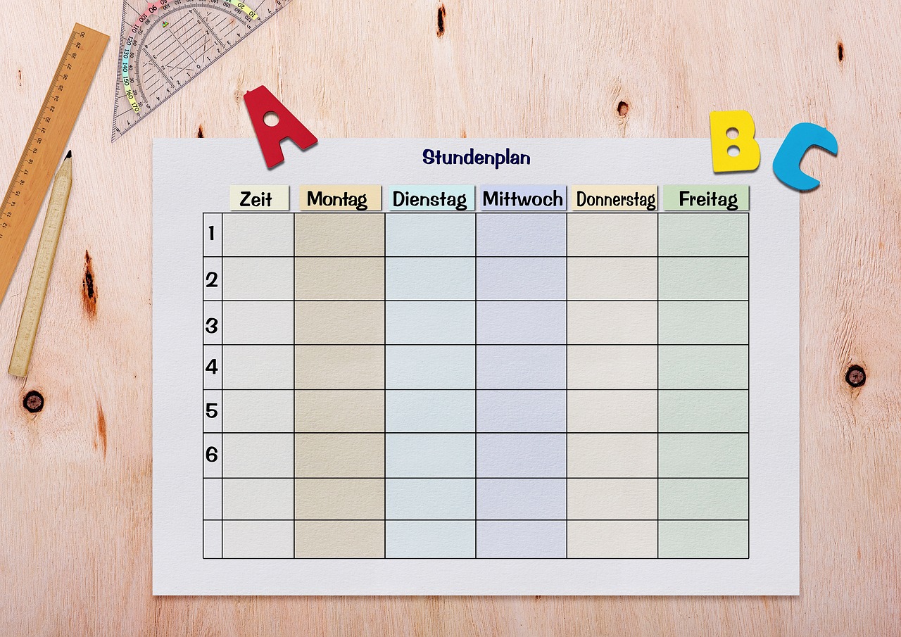 Resource Management in Education — Timetable, paper, table, ruler, triangle ruler, abc, alphabet, template, teaching, days of the week, school, students, teacher, time management, scheduler, back to school, first grader, copy space, enter, write, symbol, time, 6 hours of instruction, i dötzchen, 6 days a week, training