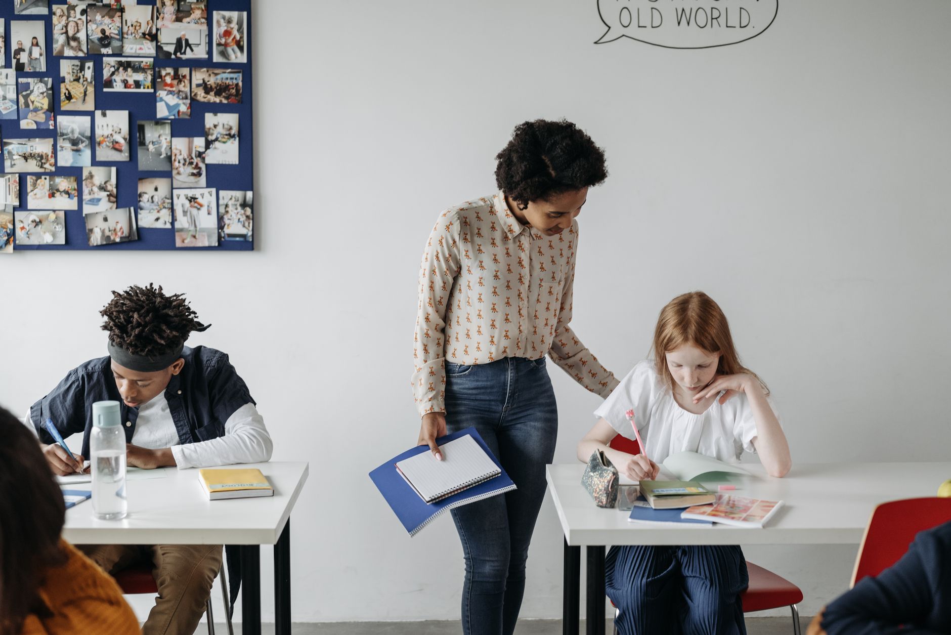 Teaching Receptive Skills: Listening and Reading — A teacher guides students during a classroom activity, fostering engaging learning.