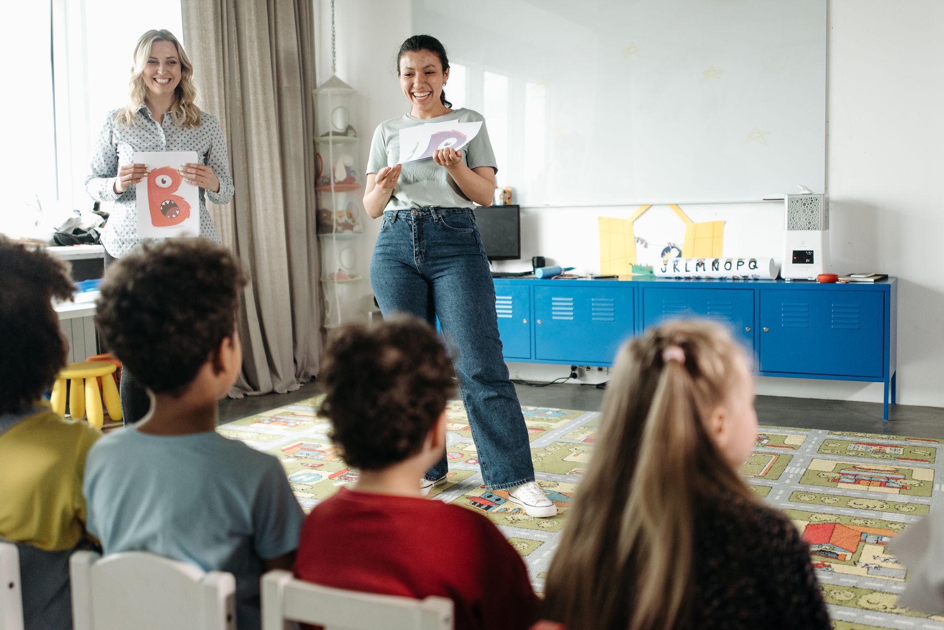 Teaching Receptive Skills: Listening and Reading — Teachers engaging kindergarten students in a fun learning environment.