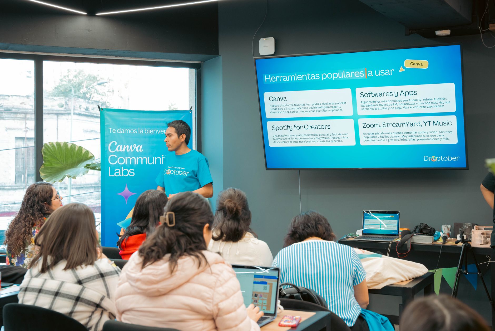 Teaching Productive Skills: Speaking and Writing — A speaker presenting technology tools in a workshop environment.