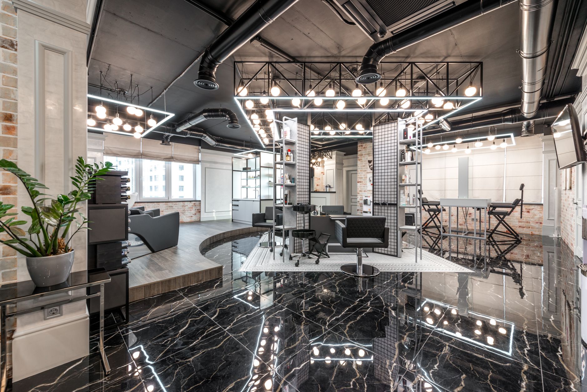 that apply in all aesthetics contexts. Units Legal and Regulatory Requirements in Aesthetic Practice — Black leather chairs placed in spacious stylish barbershop with bright glowing lamps and creative design with cosmetology products on shelves