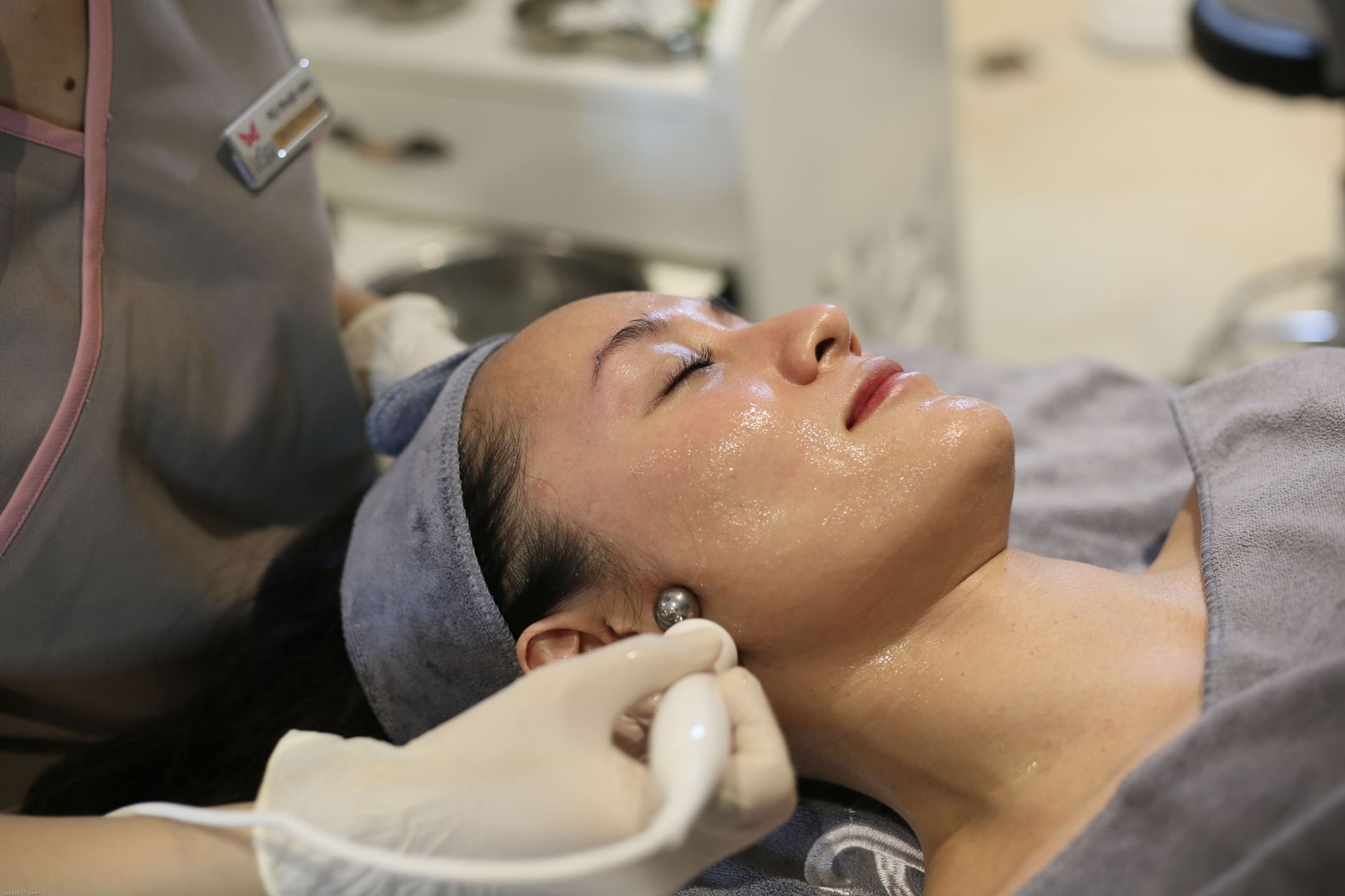 Legal, Regulatory, and Clinical Requirements for Aesthetic Practice — Close-up of a woman receiving skincare treatment in a spa in hanoi, vietnam.