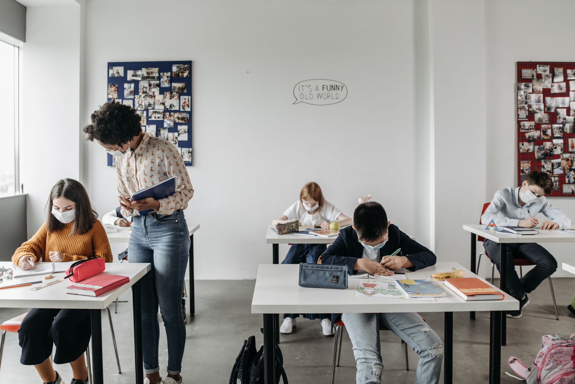 Physical Health Guidelines — Students and teacher in masks in a classroom setting post-pandemic, focusing on safe learning.