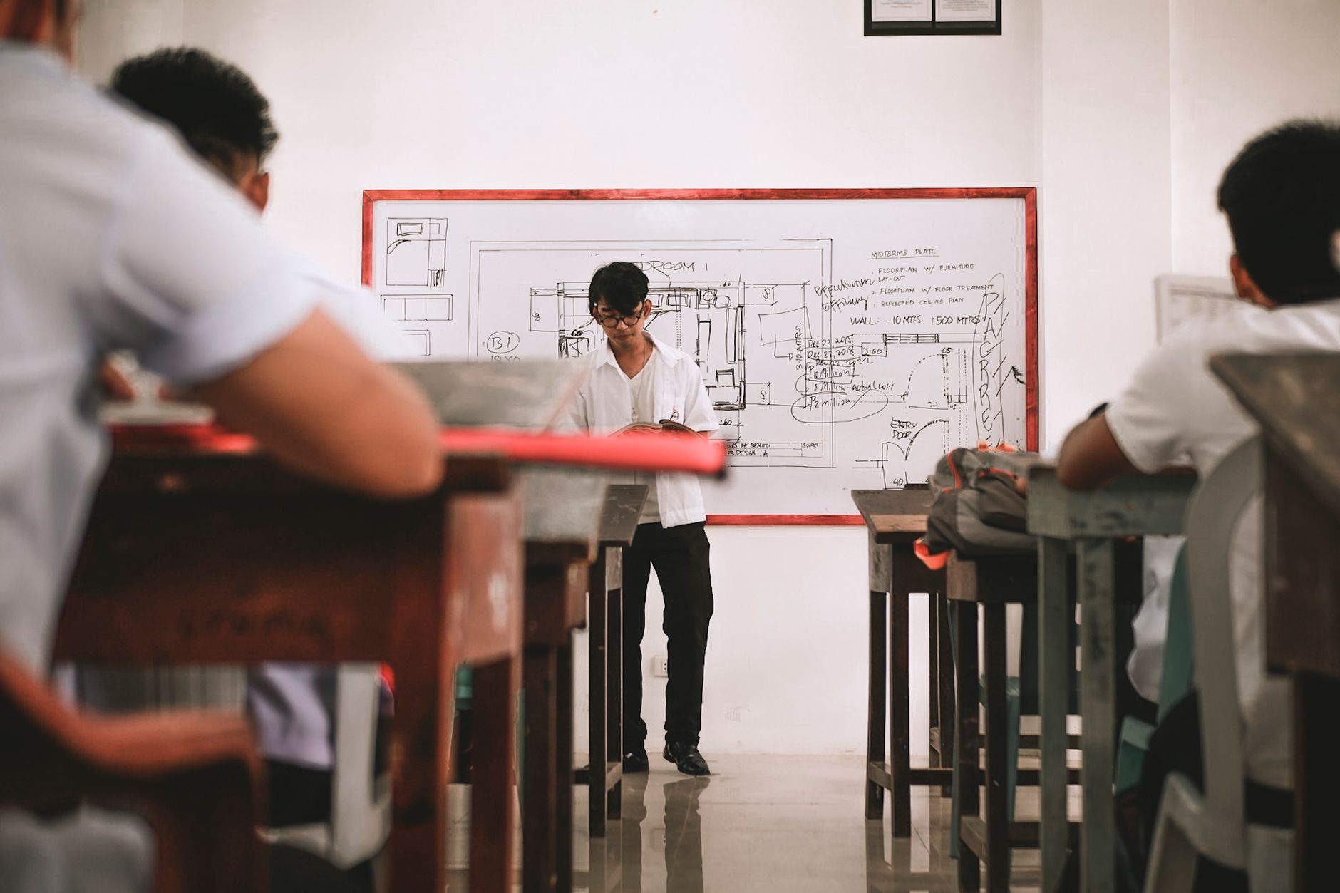 Lesson planning — A dynamic classroom scene with students attentively engaged in learning activities.