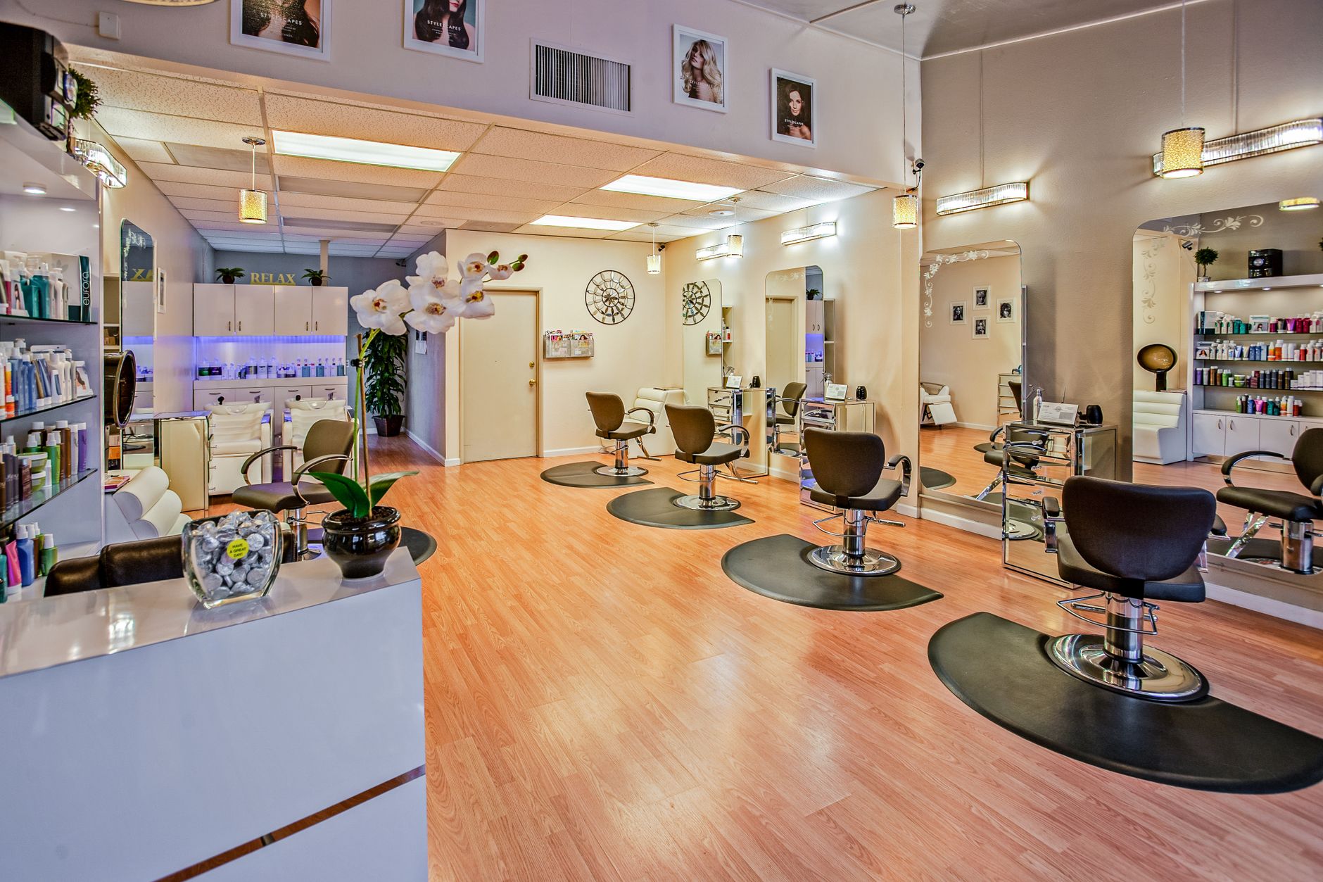 Advise on products and services — Spacious and stylish hair salon interior in del mar, ca showcasing chic design.