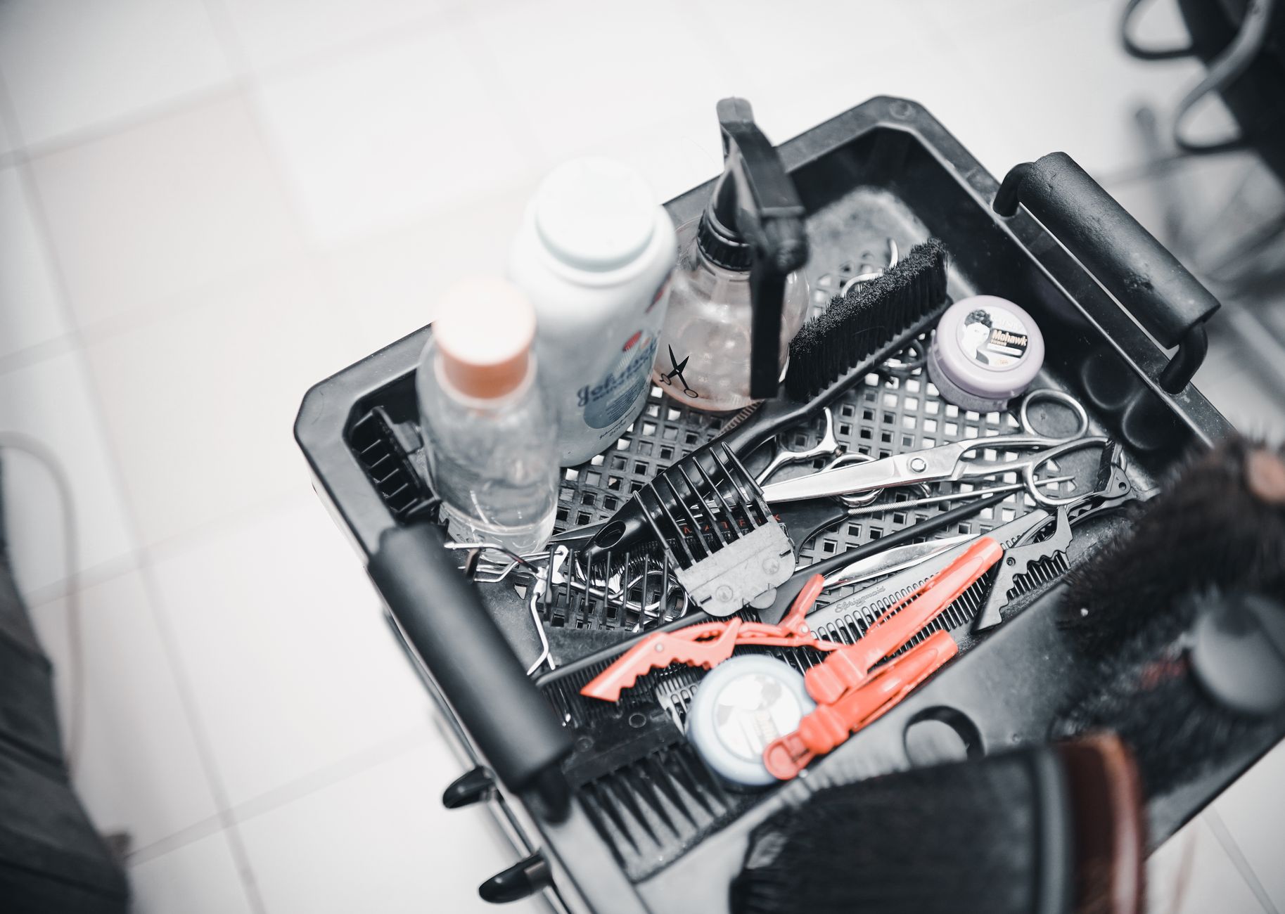 Promotional activities — A selection of hairdressing tools and products arranged in a salon trolley for professional use.