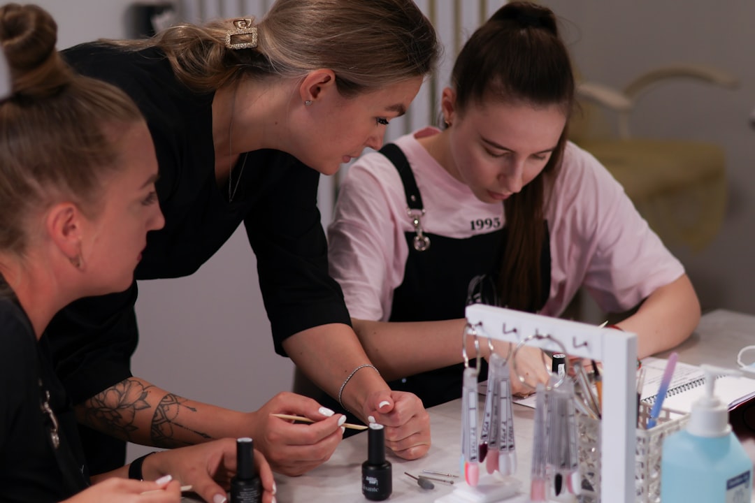 Freelance worker — A group of women sitting around a table working on nail polish