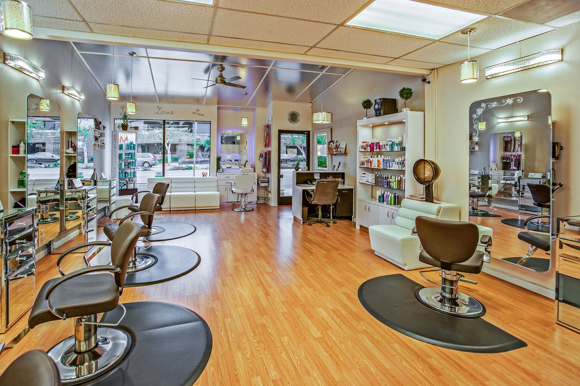 Advise on products and services — Spacious hair salon in del mar, california featuring contemporary design and ample seating.