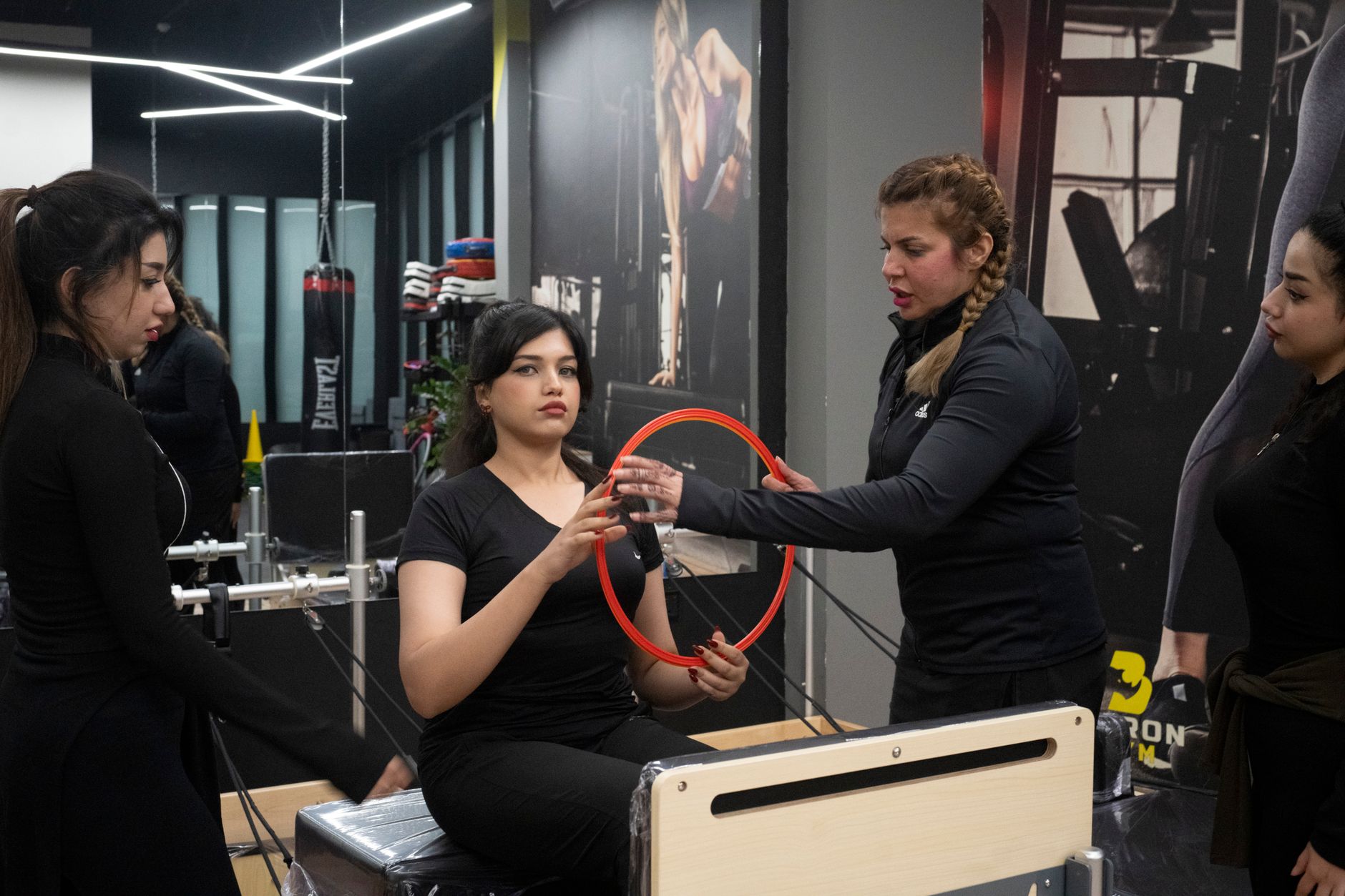 Anatomy, physiology and pathology — Women in a fitness class using pilates equipment indoors. enthusiastic and engaging session for health and fitness.
