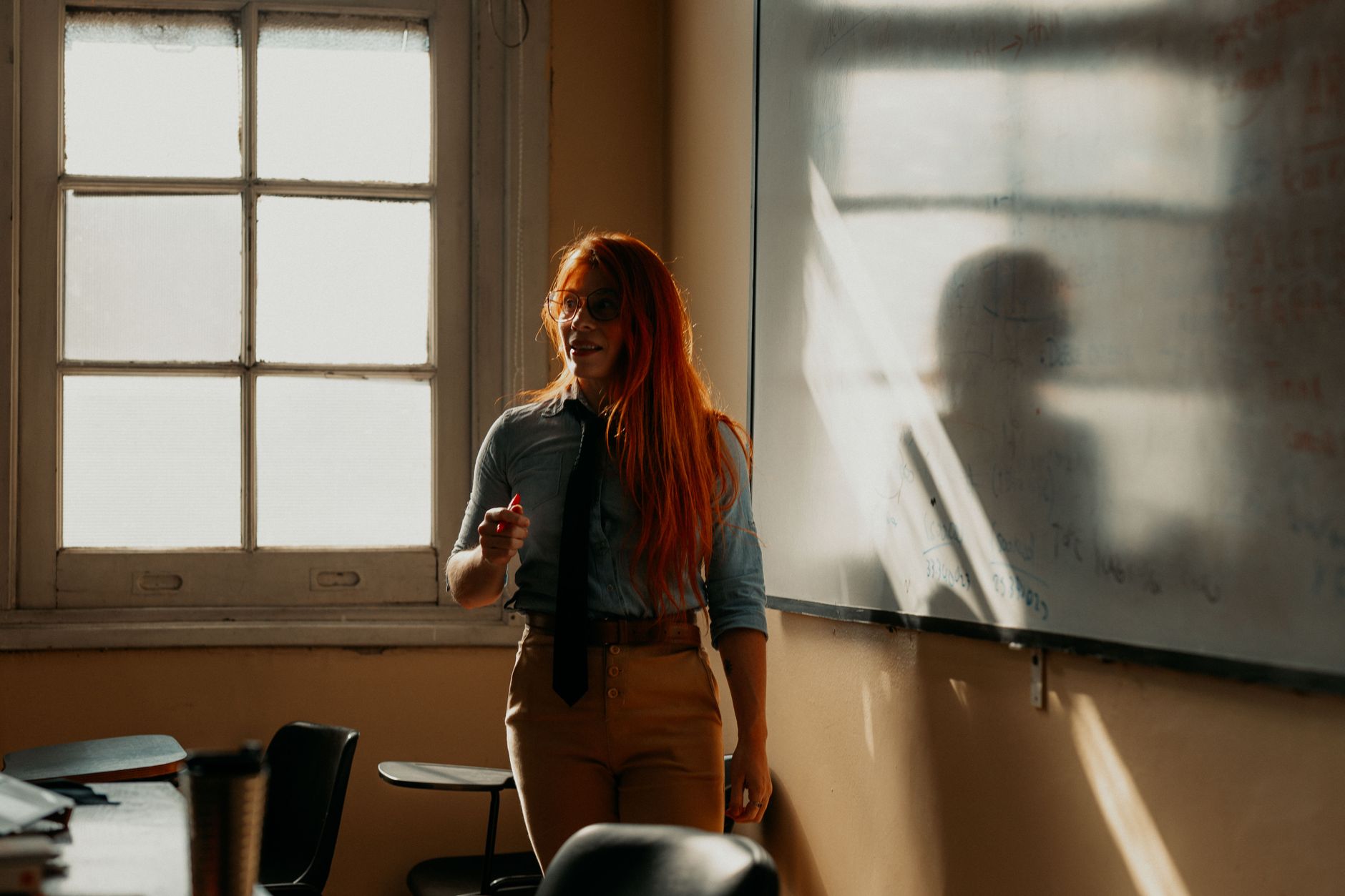 Thermal therapy massage — Sunlit classroom in buenos aires with a teacher at the whiteboard during a lesson.