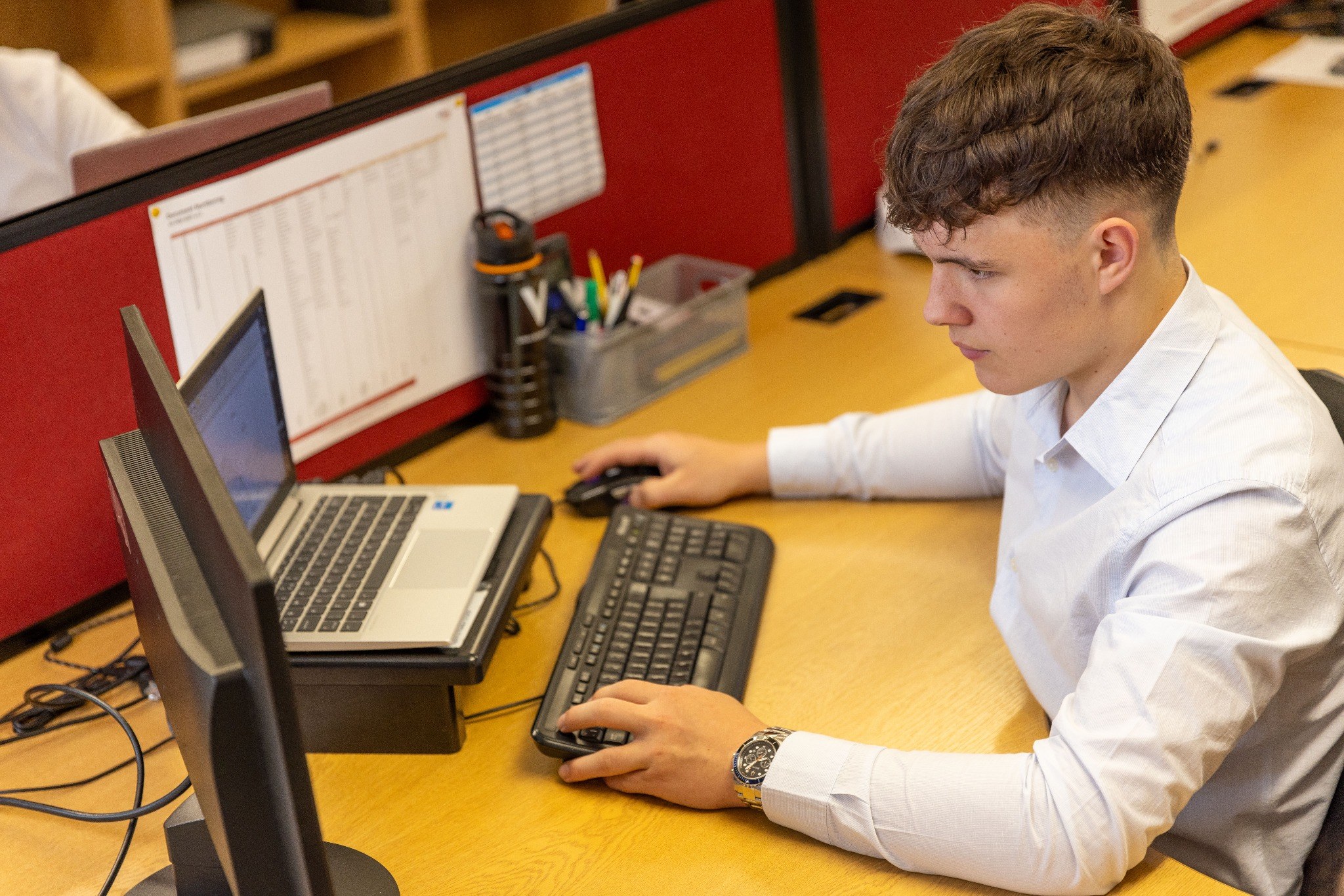 Pathway Level 4 Diploma in Information Technology — Group of high school students focused on learning in a computer lab setting.